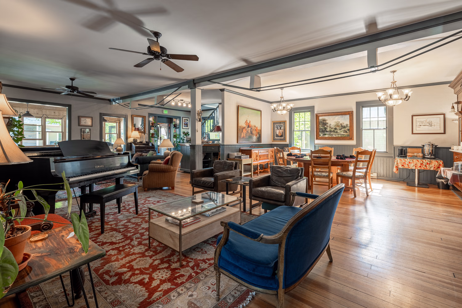 Historic lobby at Elk Mountain Lodge with a grand piano and hardwood floors in downtown Crested Butte, Colorado