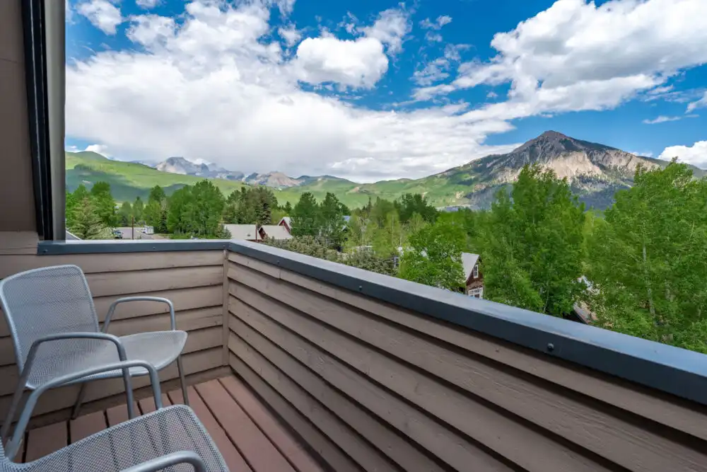 Guest room balcony with views of Mt. Crested Butte at Elk Mountain Lodge, Colorado