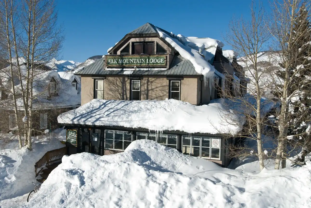 Elk Mountain Lodge exterior covered in snow during winter in Crested Butte, Colorado